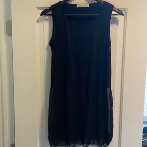 Black tank top with sheer bottom. Size L